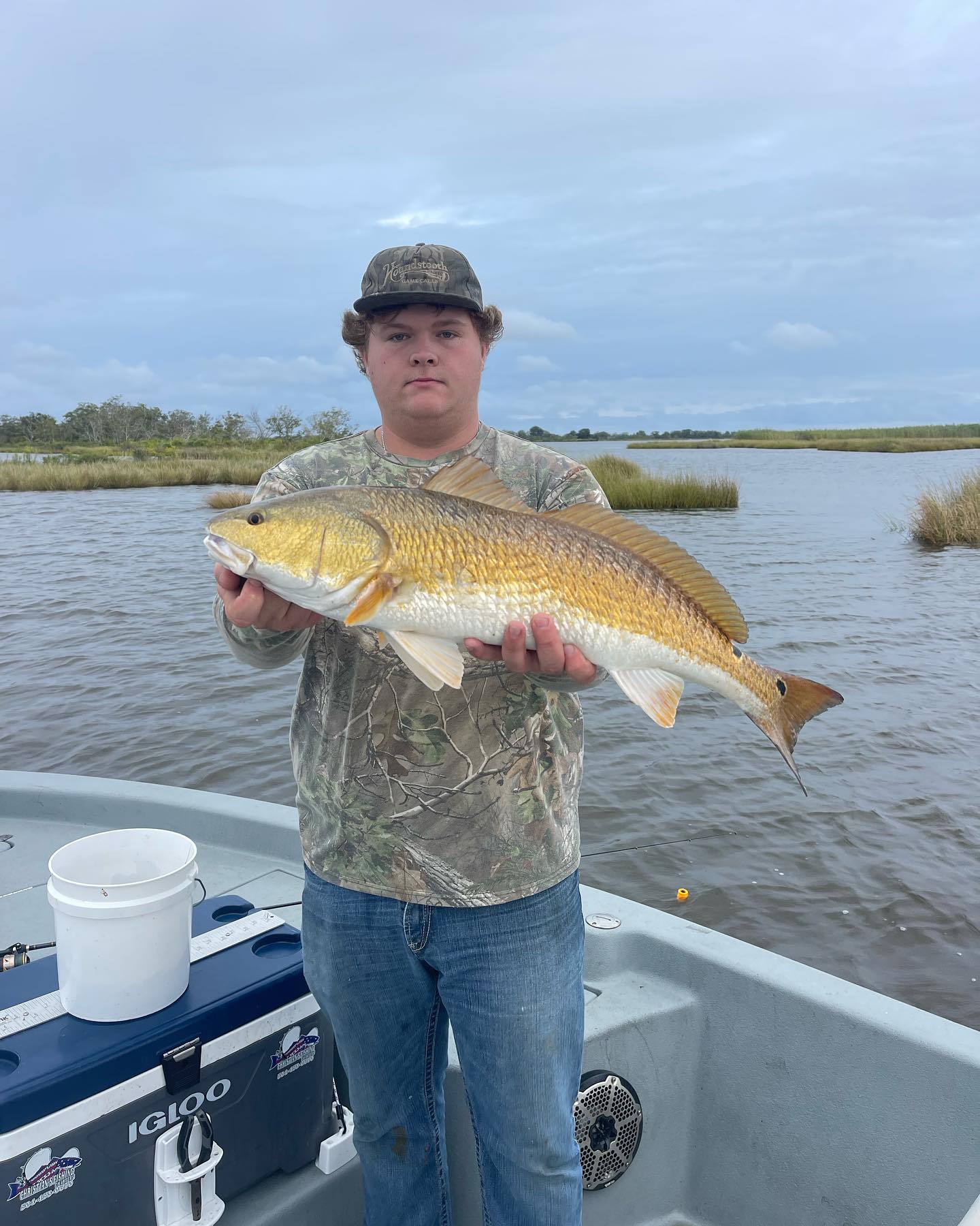 Angler with a 24-inch redfish caught in Barataria