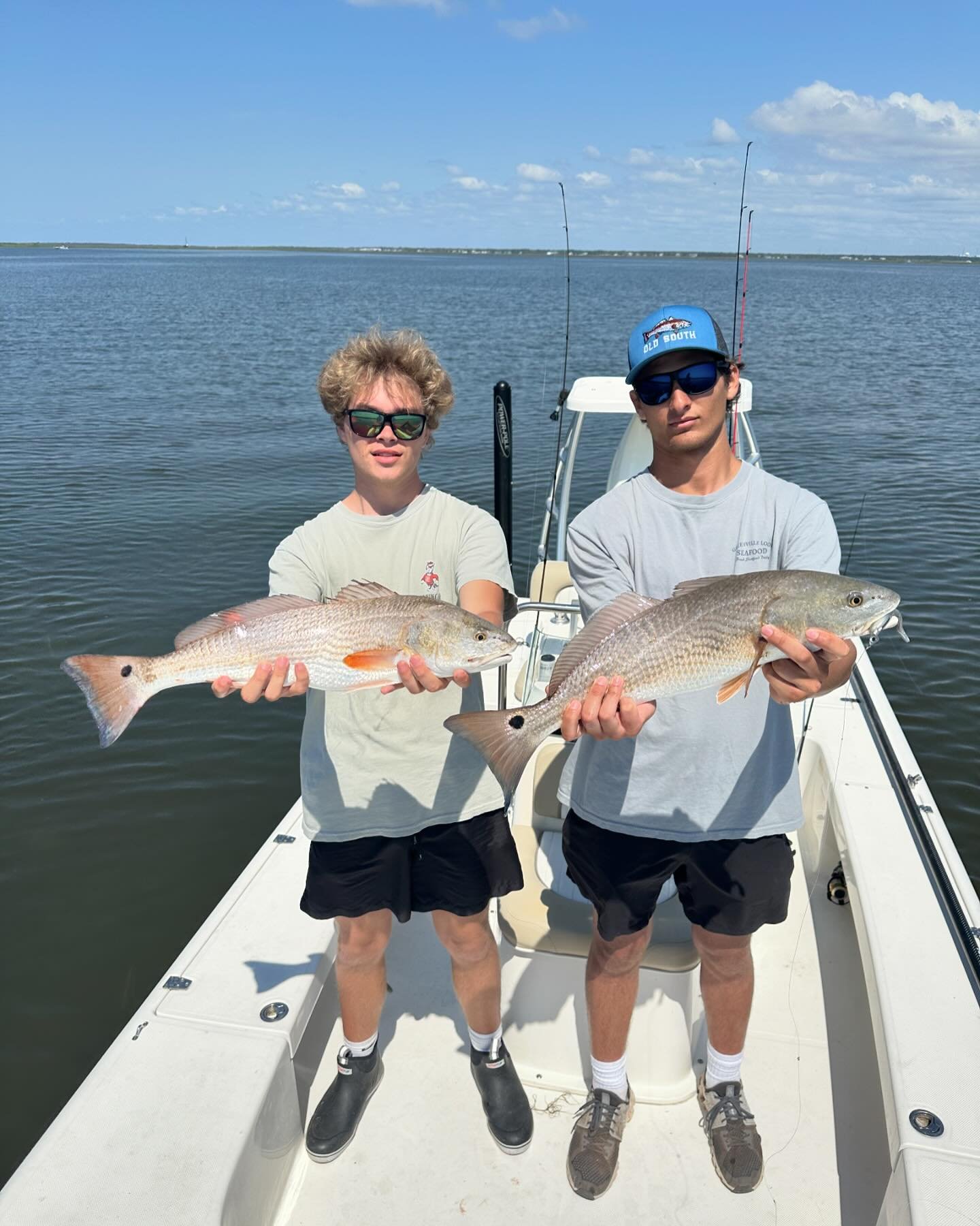 Two anglers with their catch of Atlantic Croaker and Redfish in North Carolina