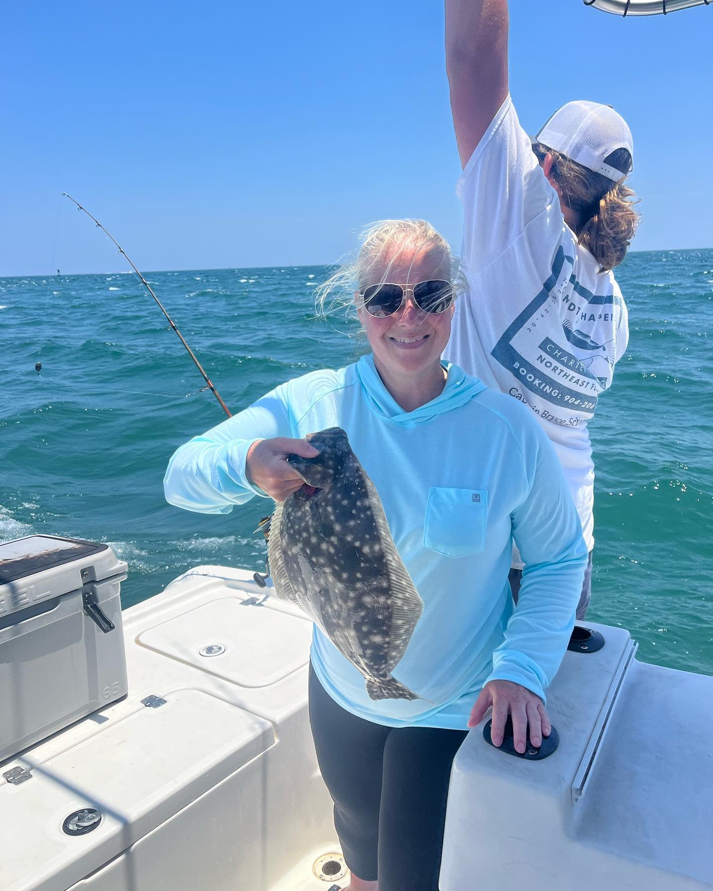 A person fishing for a California Flounder in Fernandina Beach