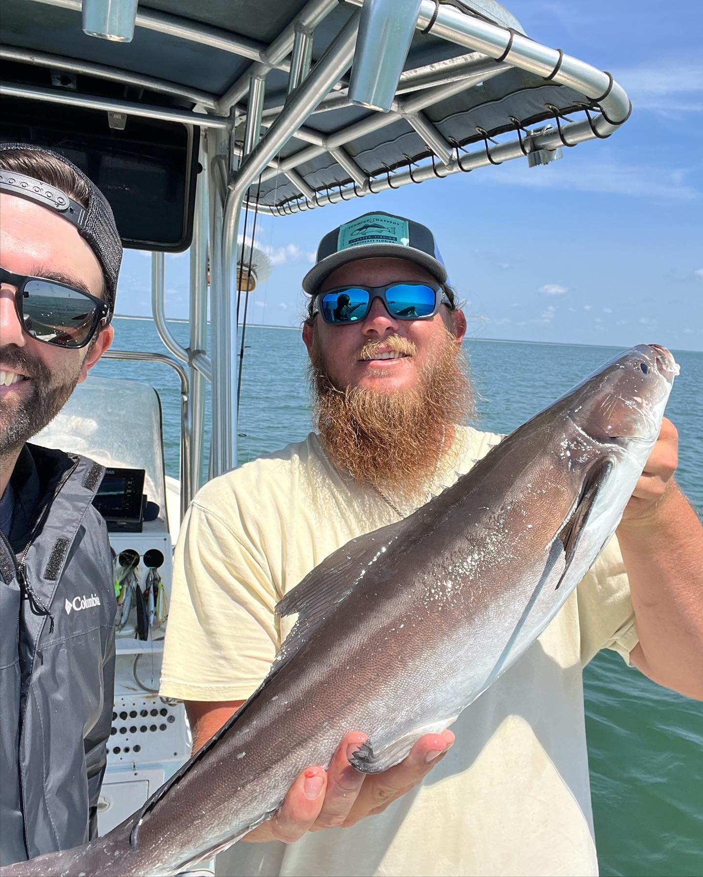 A fisherman holds a 21-inch fish at Fernandina Beach