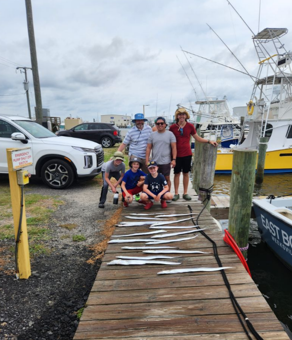 Five people enjoying a fishing trip at Wanchese