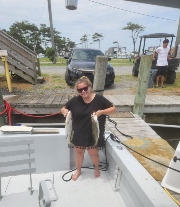 Two anglers with their catch in Wanchese