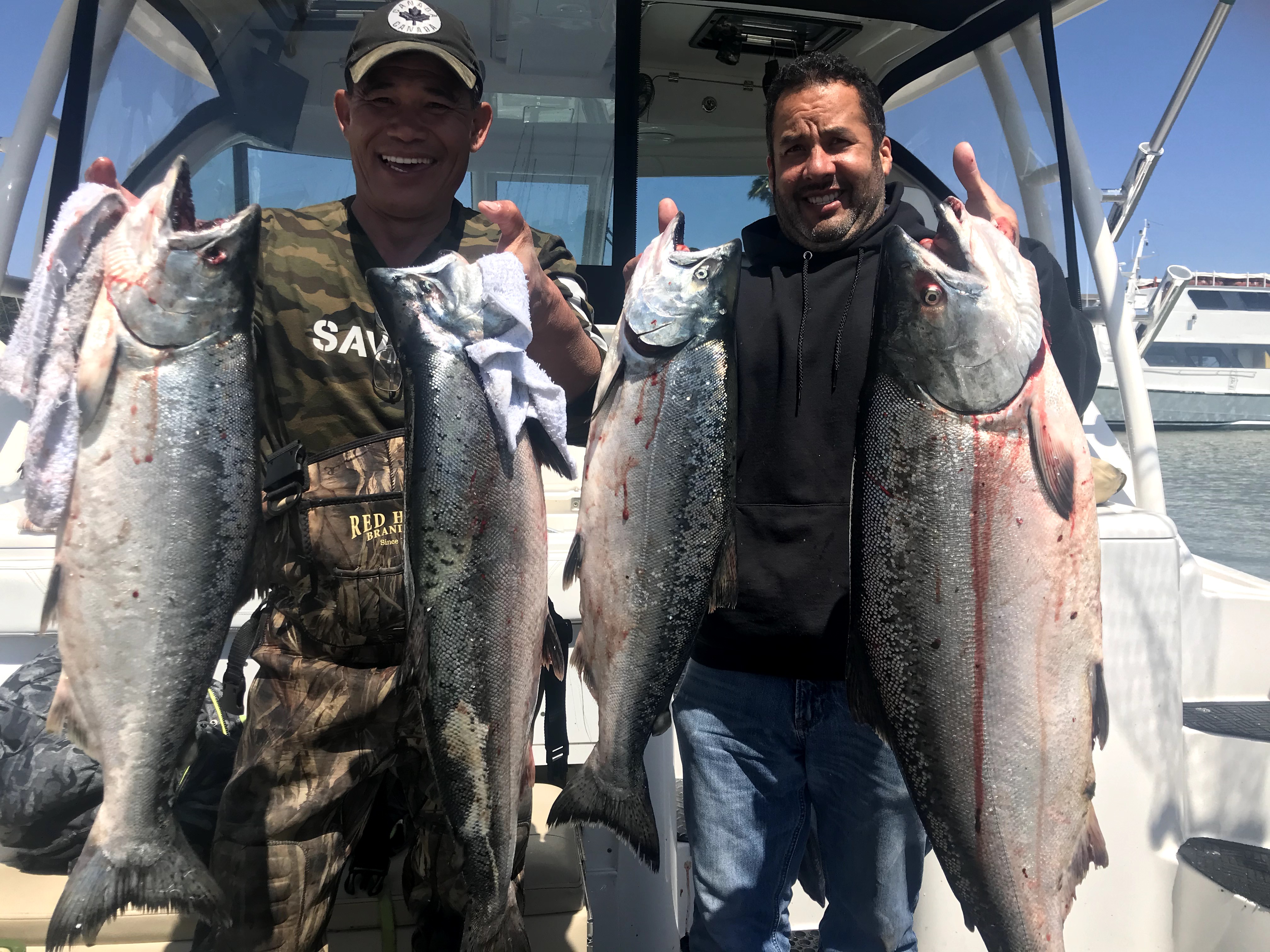 Salmon fishing boat with rods and tackle for August inshore fishing trips