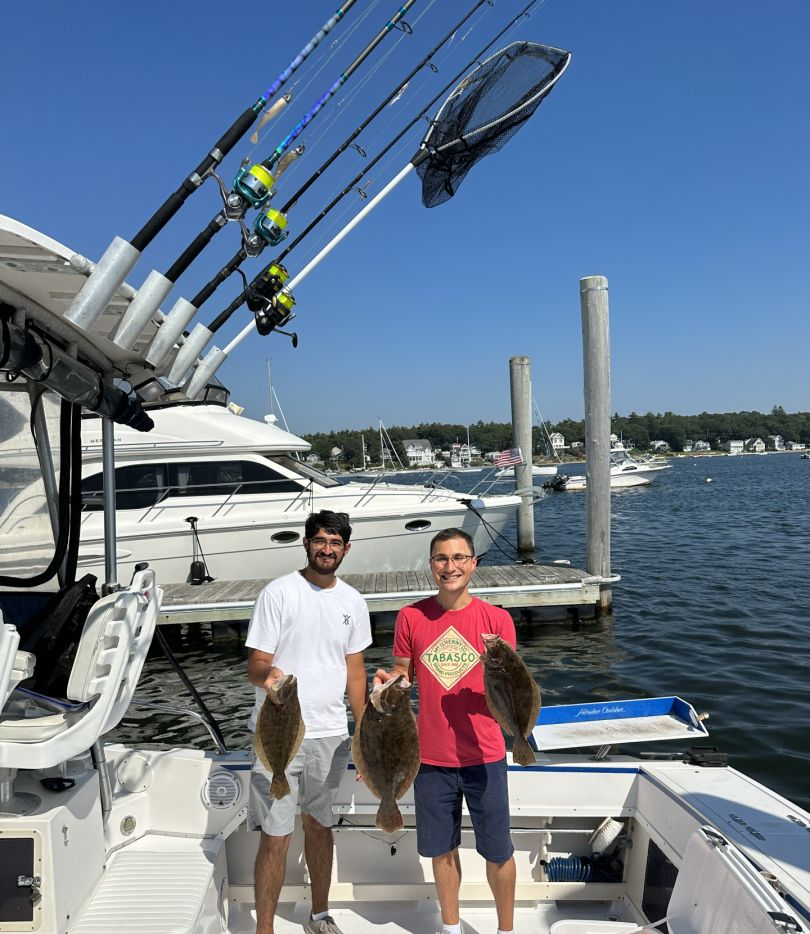 Two anglers with their fresh fishing catch in Wareham