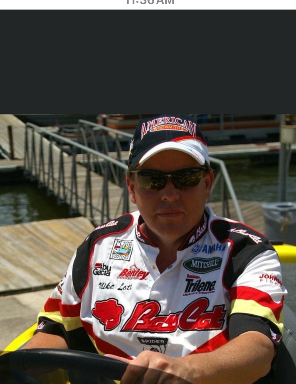Professional angler in fishing tournament gear at marina dock in Galveston TX