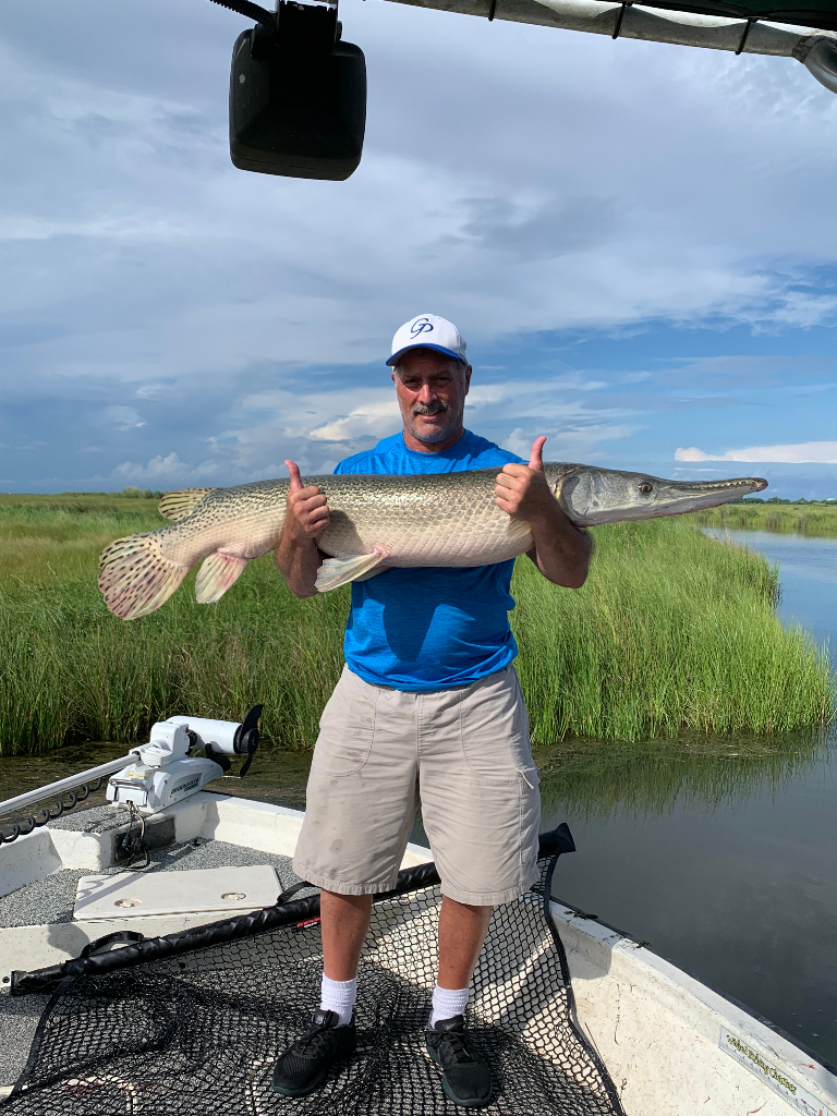 One person holding a 13-inch fish in LA