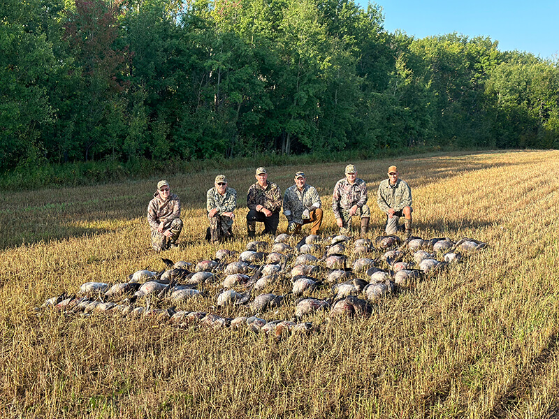 Group of 6 people fishing and hunting in Saskatchewan