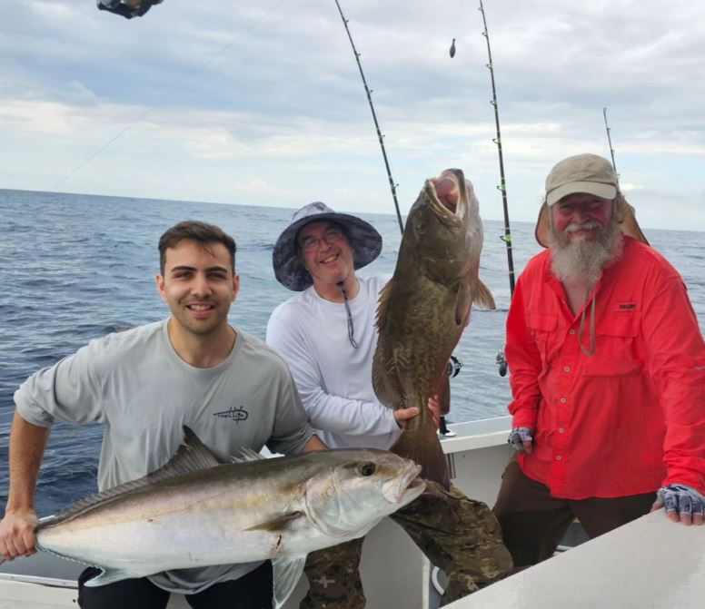 Two large greater amberjack fish caught by three people fishing at Port Canaveral