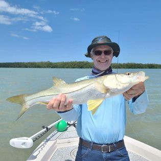 A lone angler fishing in the waters of Fort Myers