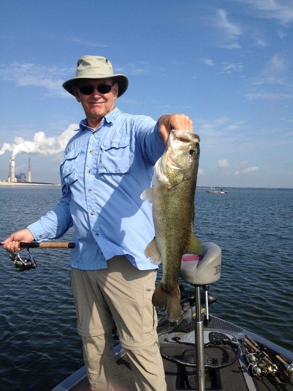 Lone angler holding big 22-inch fish in Burnet