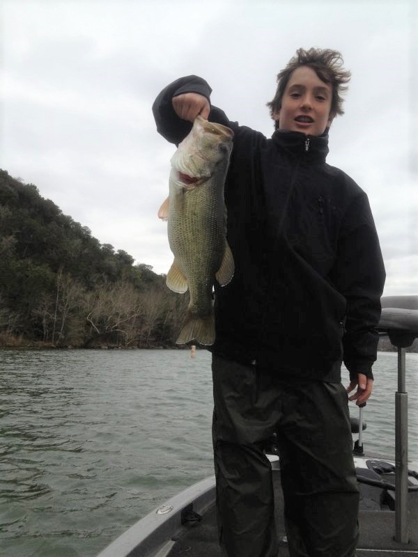 A man holding a large largemouth bass fish in Burnet, Texas