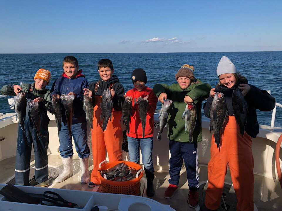 Group of 7 people fishing for 6 big fish in NY