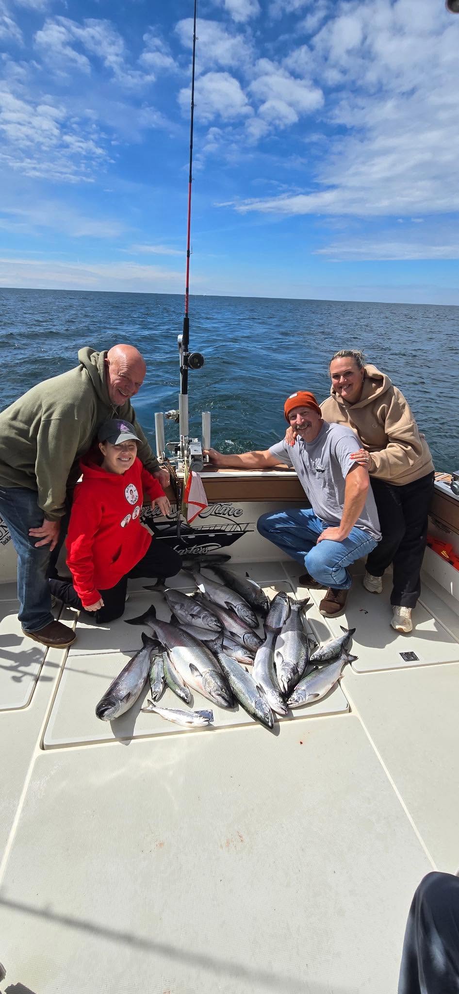 Successful fishing trip in Muskegon MI with fresh caught fish displayed on boat deck