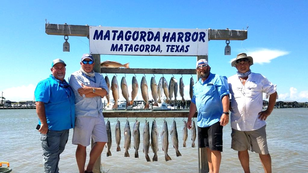 Group of 4 people enjoying a fishing trip on Bolivar Peninsula
