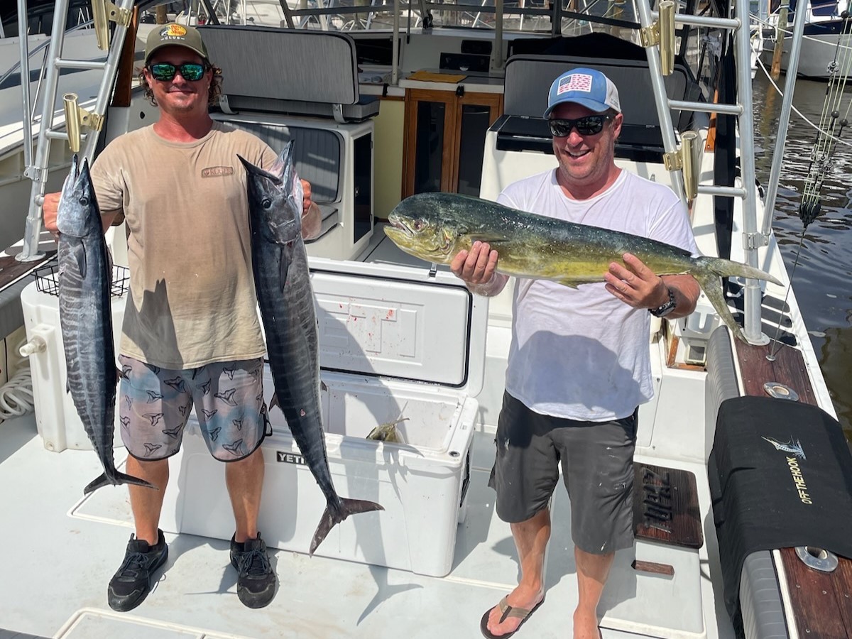 Sebastian Inlet inshore fishing charter boat with captain and guests fishing for redfish and snook