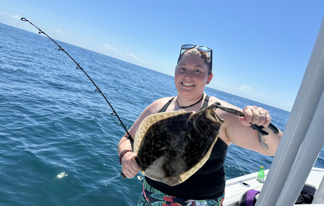 A fisherman enjoying a successful catch in Wilmington