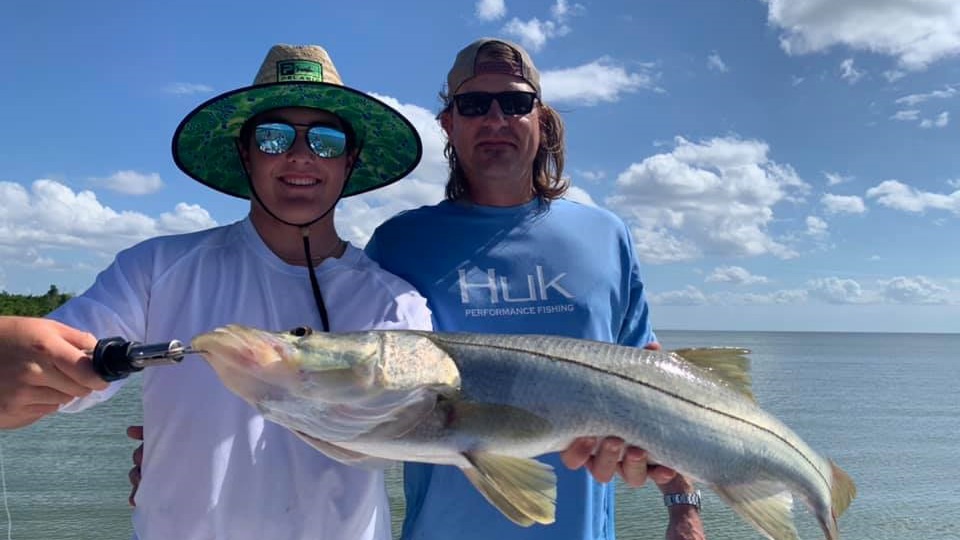 Two people fishing at Chokoloskee with a 28-inch fish
