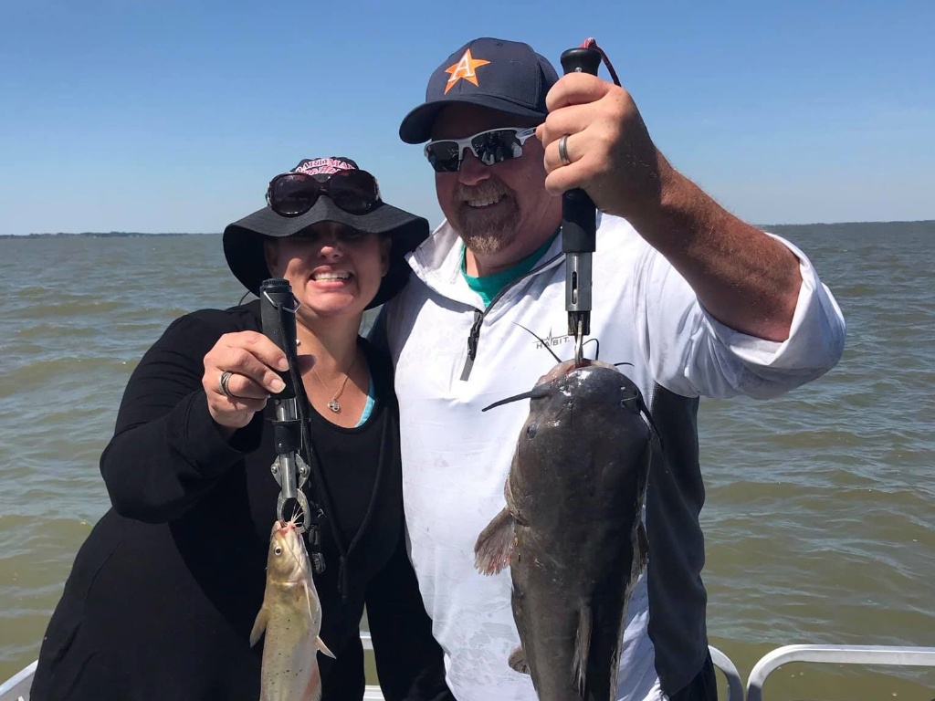 Two blue catfish and hardhead sea catfish in a fishing scene in Ohio
