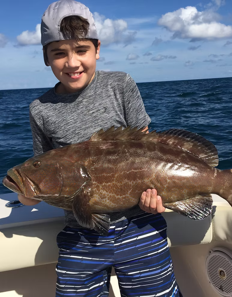 Catch of the day - a massive black grouper fish caught in Dania Beach