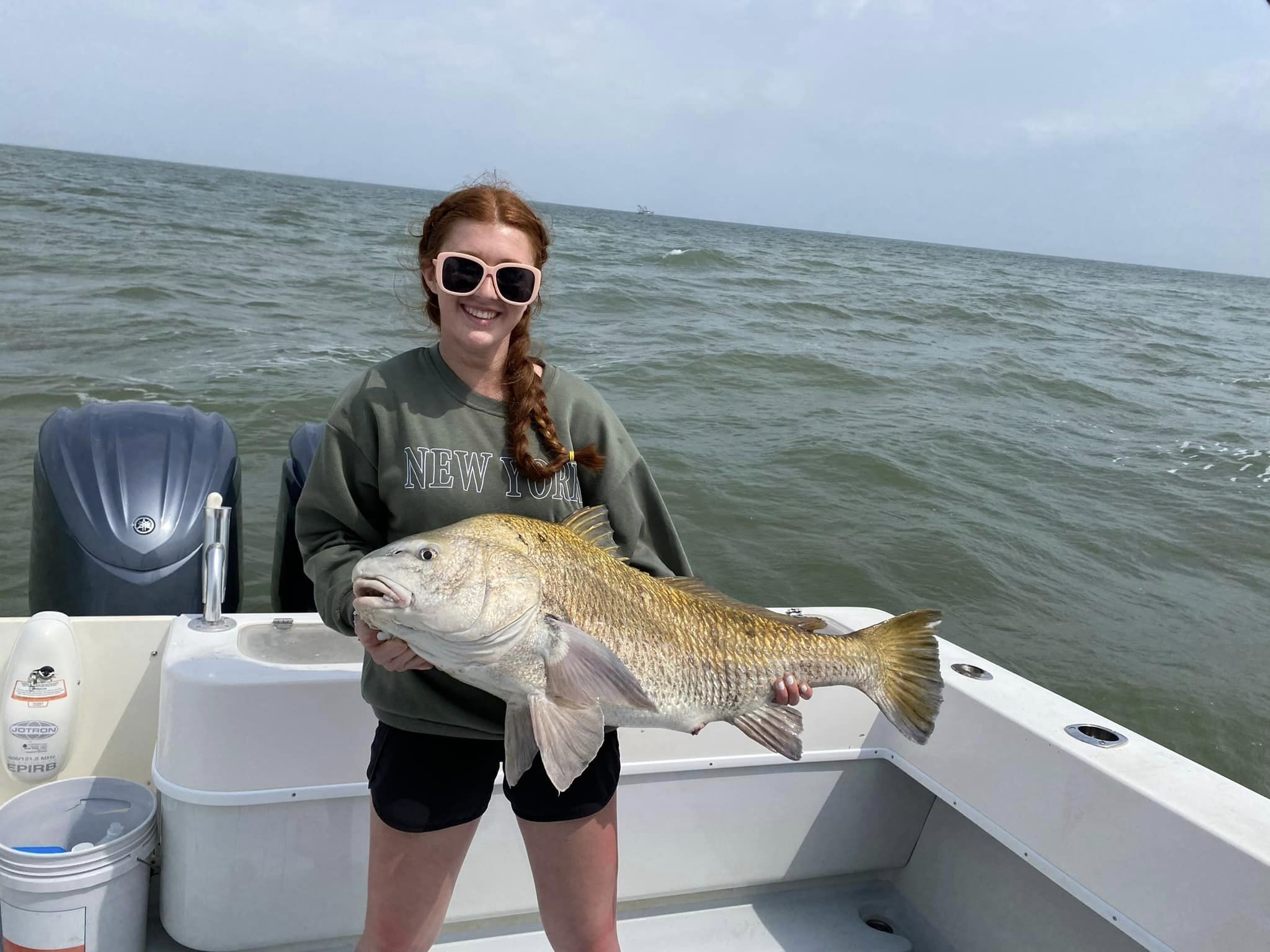 Angler with a large black drum fish in Galveston, Texas