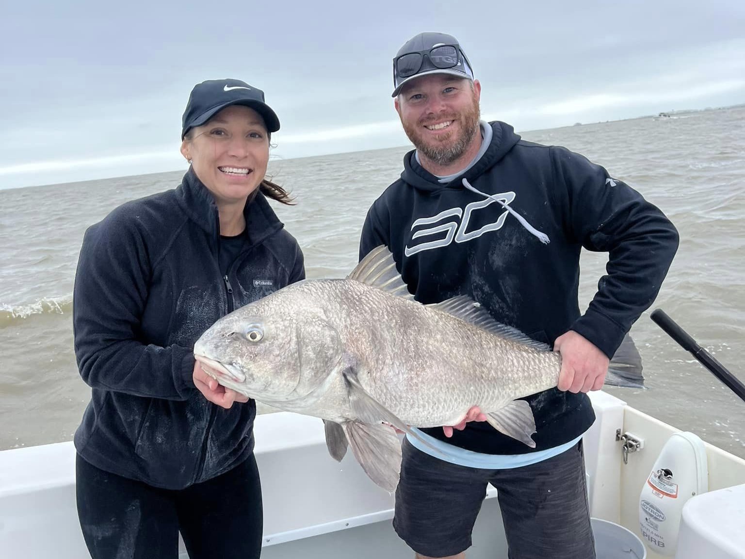 Two people enjoying a fishing trip in Galveston