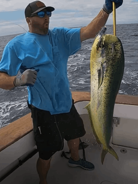 A lone fisherman reeling in a big catch in North Carolina