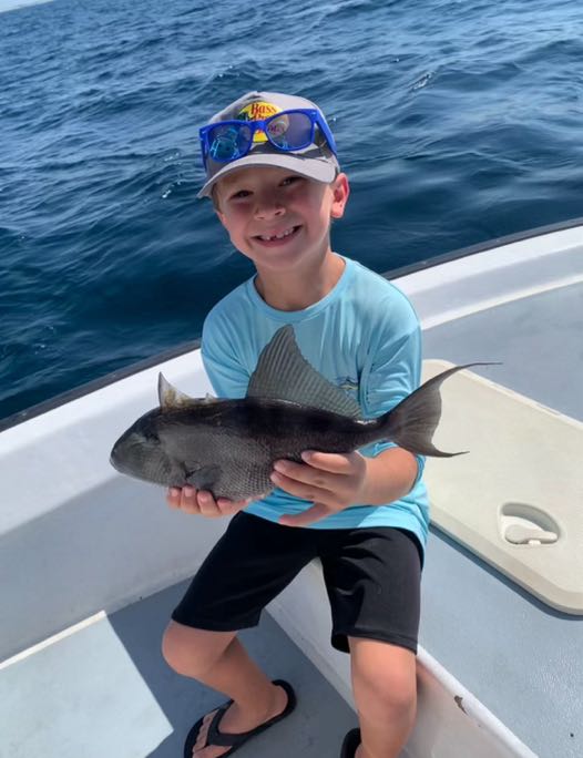 Angler with 15-inch fish caught in Florida during cruises and fishing