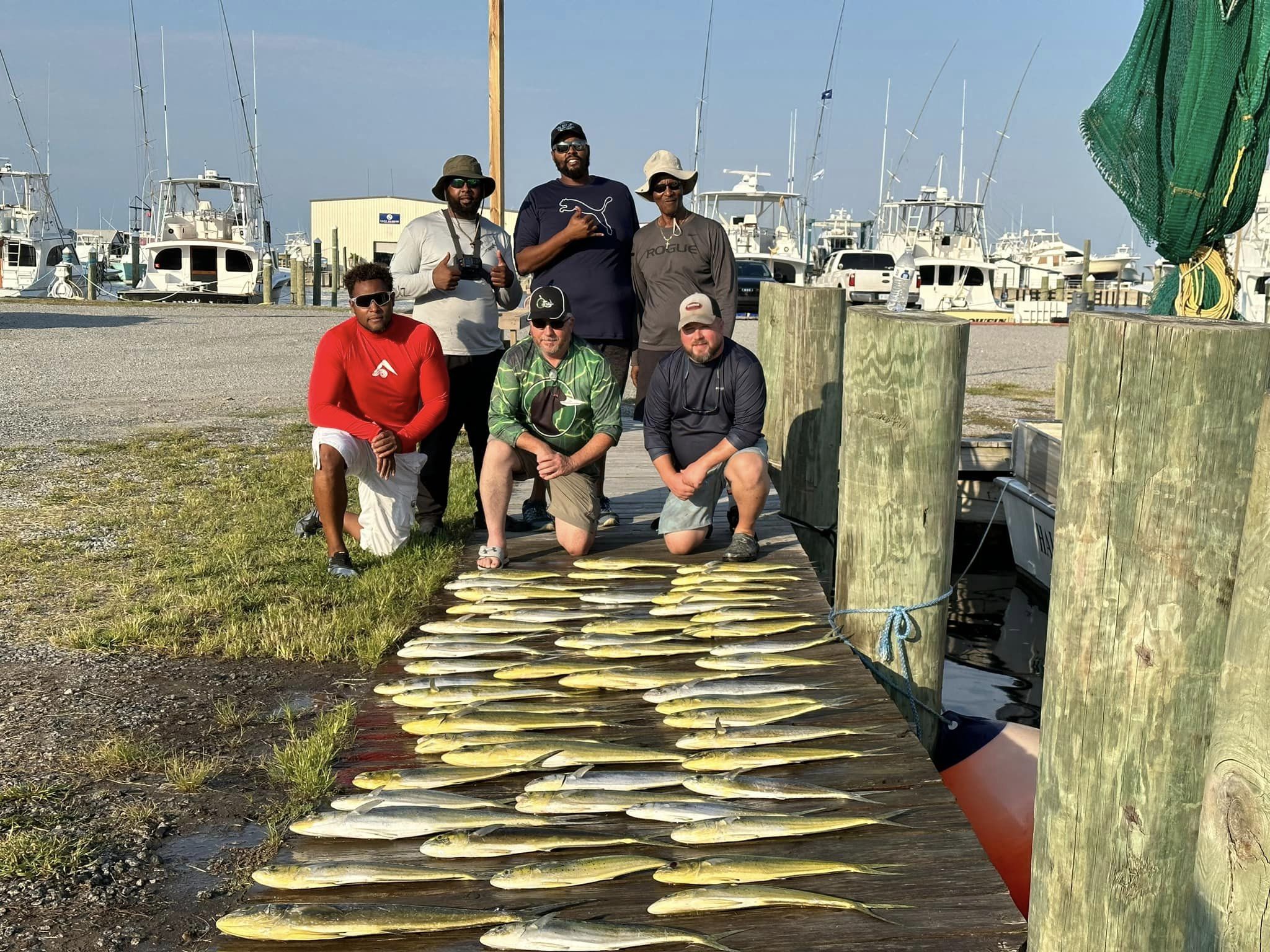 Group of six people enjoying fishing trip in NC