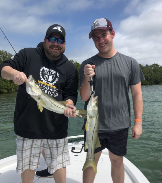 Two snook fish being caught during a fishing tour in St. Petersburg