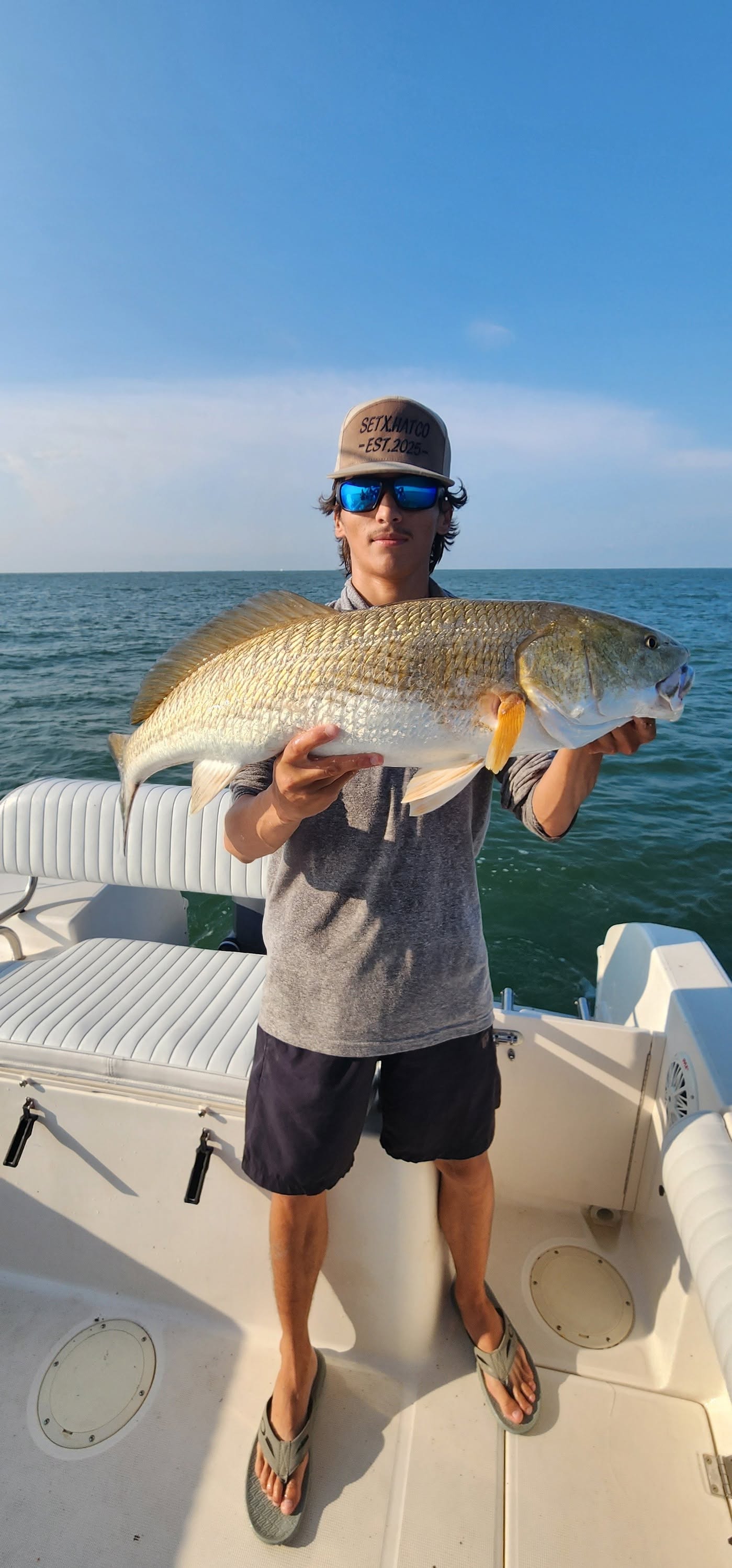 Redfish caught while fishing in Galveston TX displayed on boat deck
