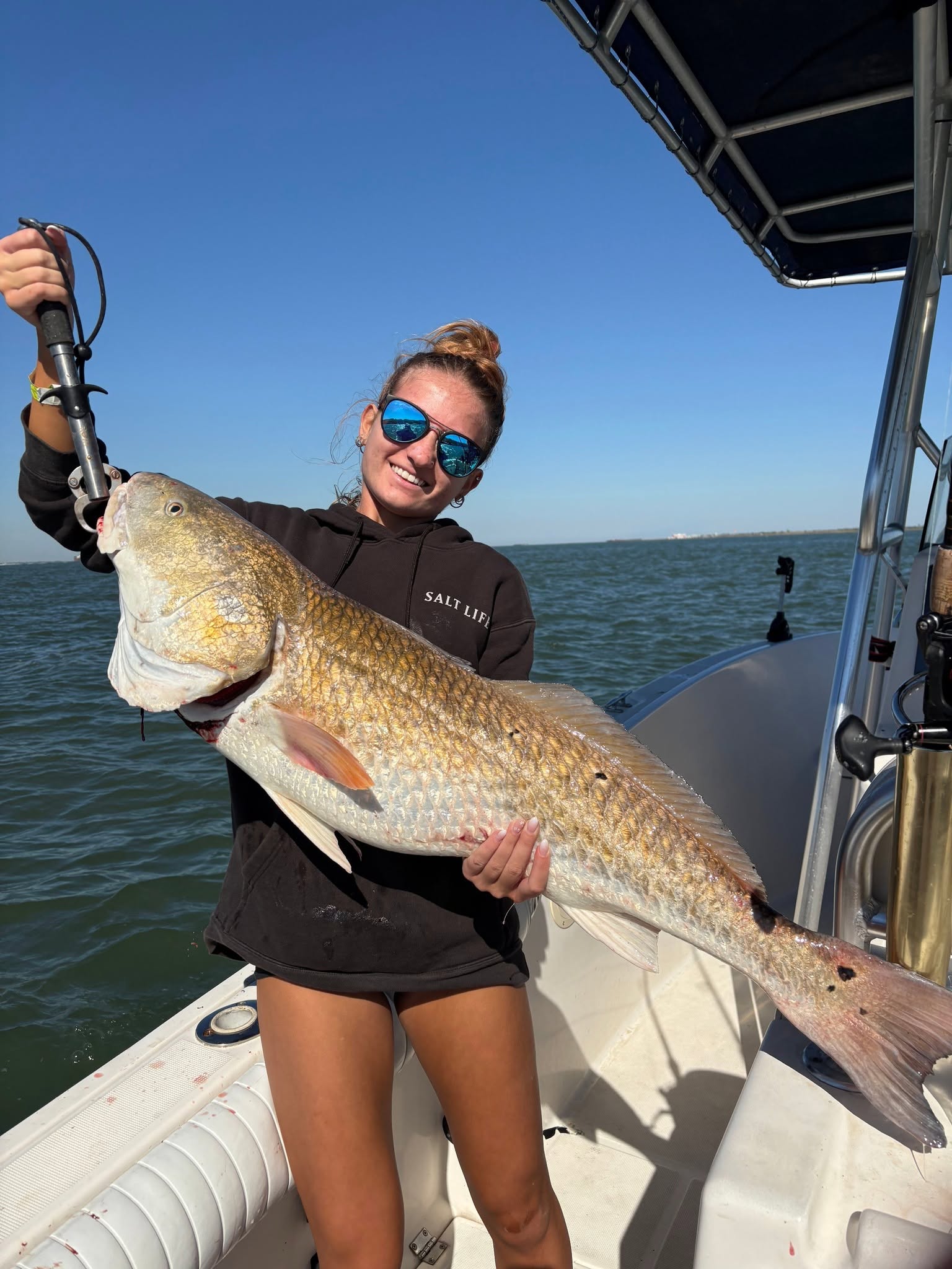 Large redfish caught while fishing in Galveston TX waters from boat