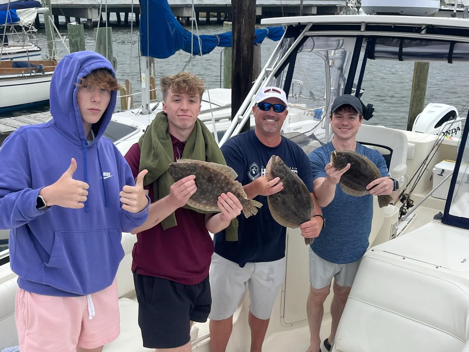 Two summer flounder fish caught by 4 people in Somers Point