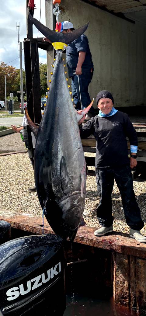 Cape Cod bluefin tuna fishing charter boat with anglers targeting giant tuna offshore