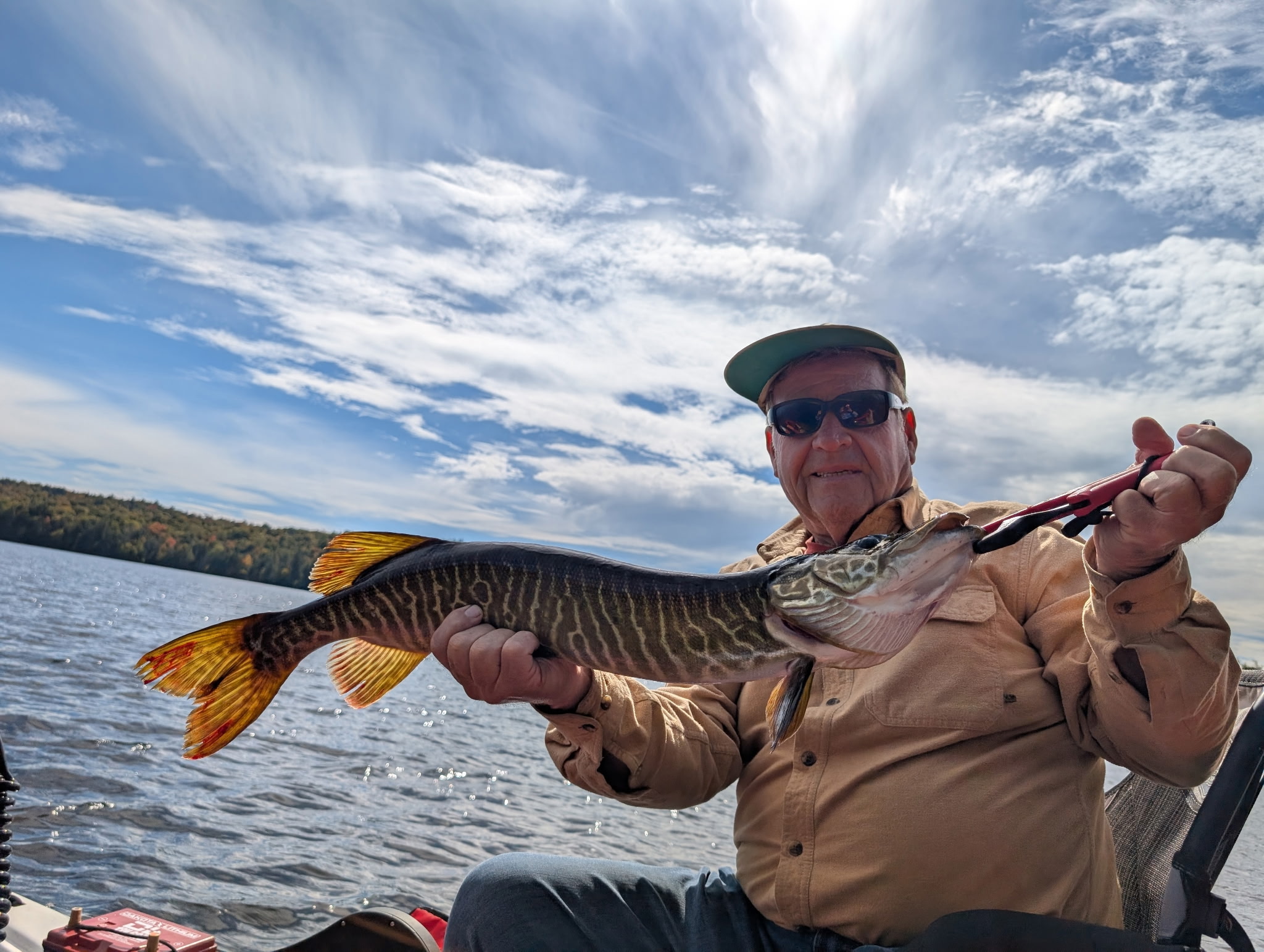 Angler enjoying a day of fishing at an unknown location