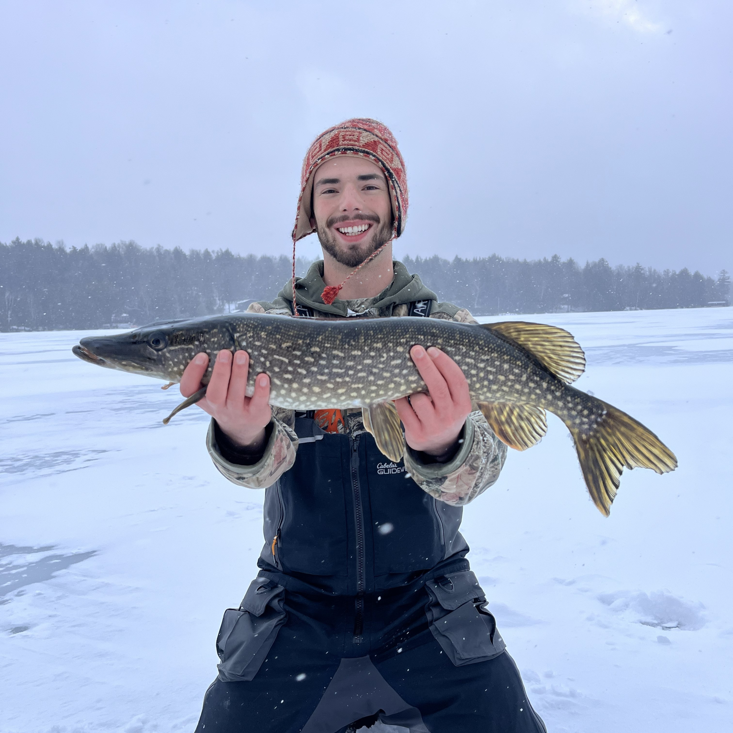 Guided ice fishing for Northern Pike on frozen lake in Upstate New York with professional guide