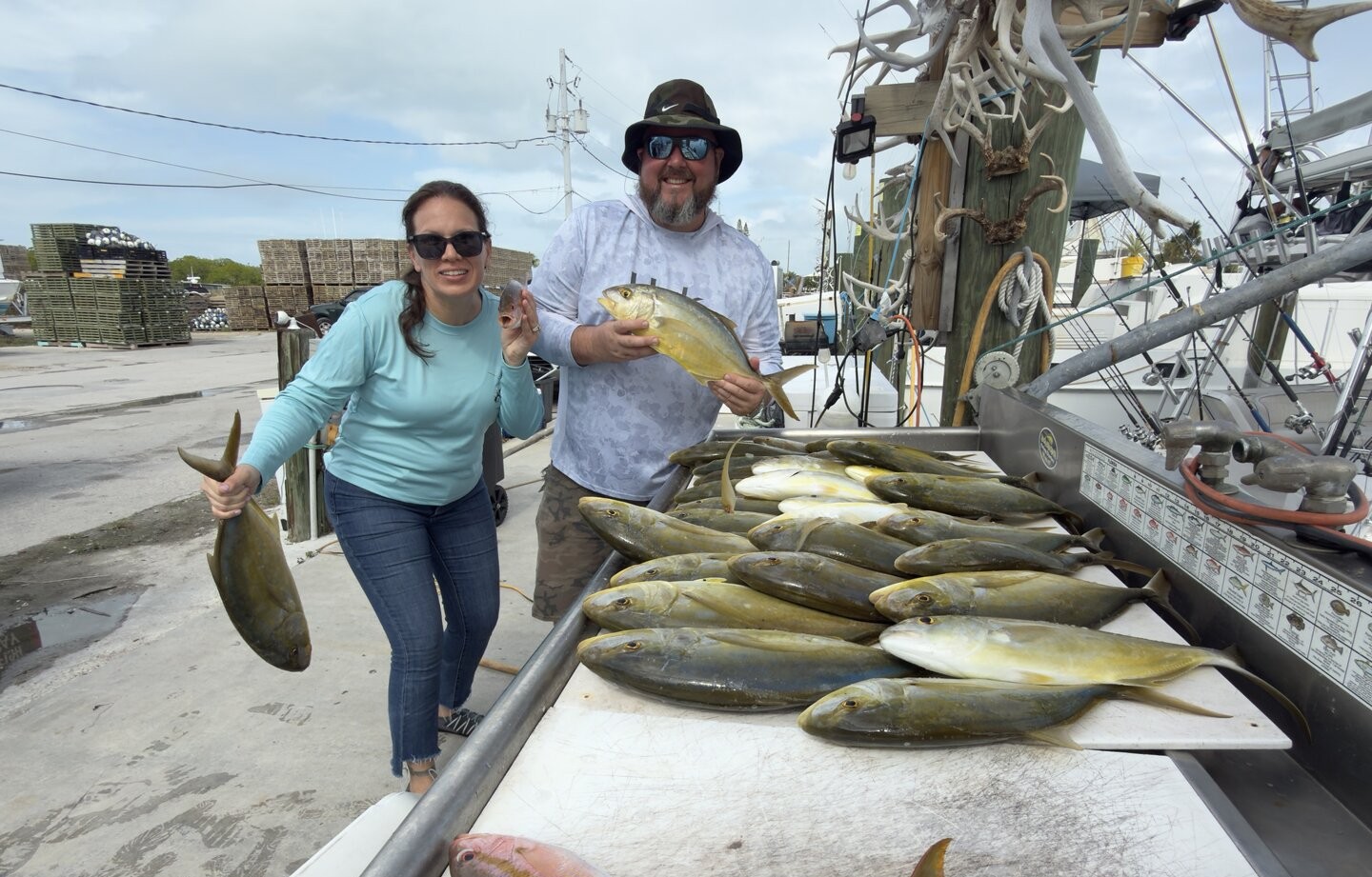 Fishing charter catch displayed on dock in Marathon FL showing multiple fish species