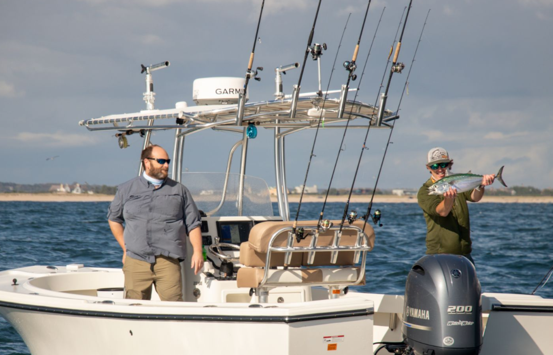 Two anglers fishing in New York with one fish caught