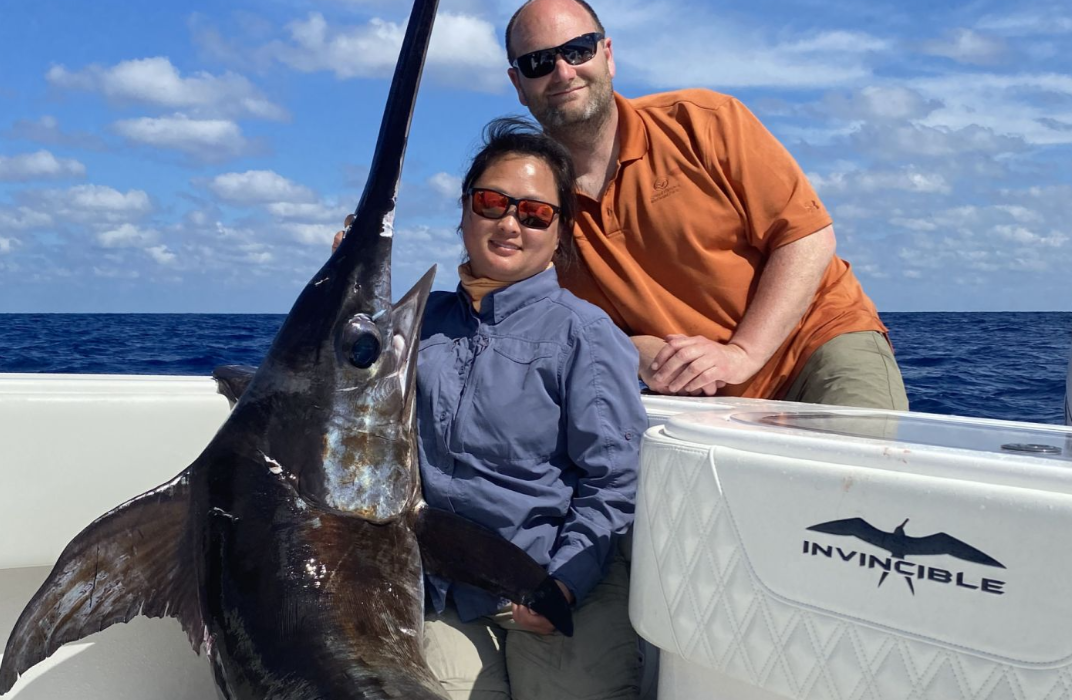 Man and woman fishing in New York with 1 big fish