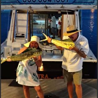 Two fishing rods with a scenic Florida landscape