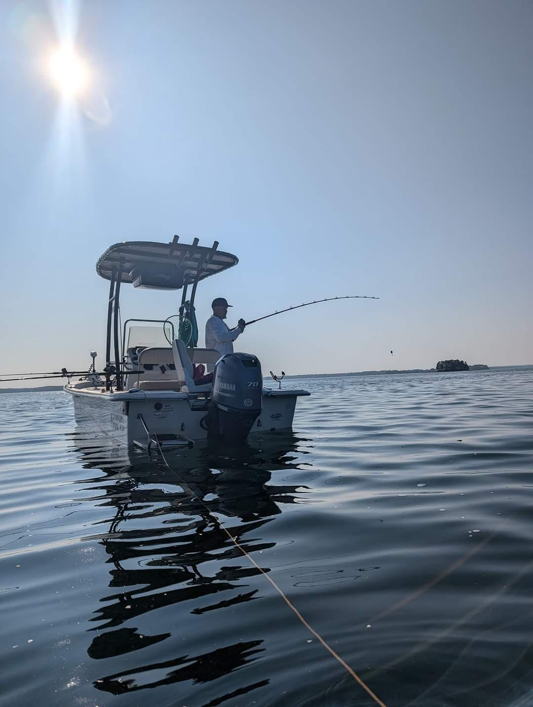 A person fishing in the Hartwell location.