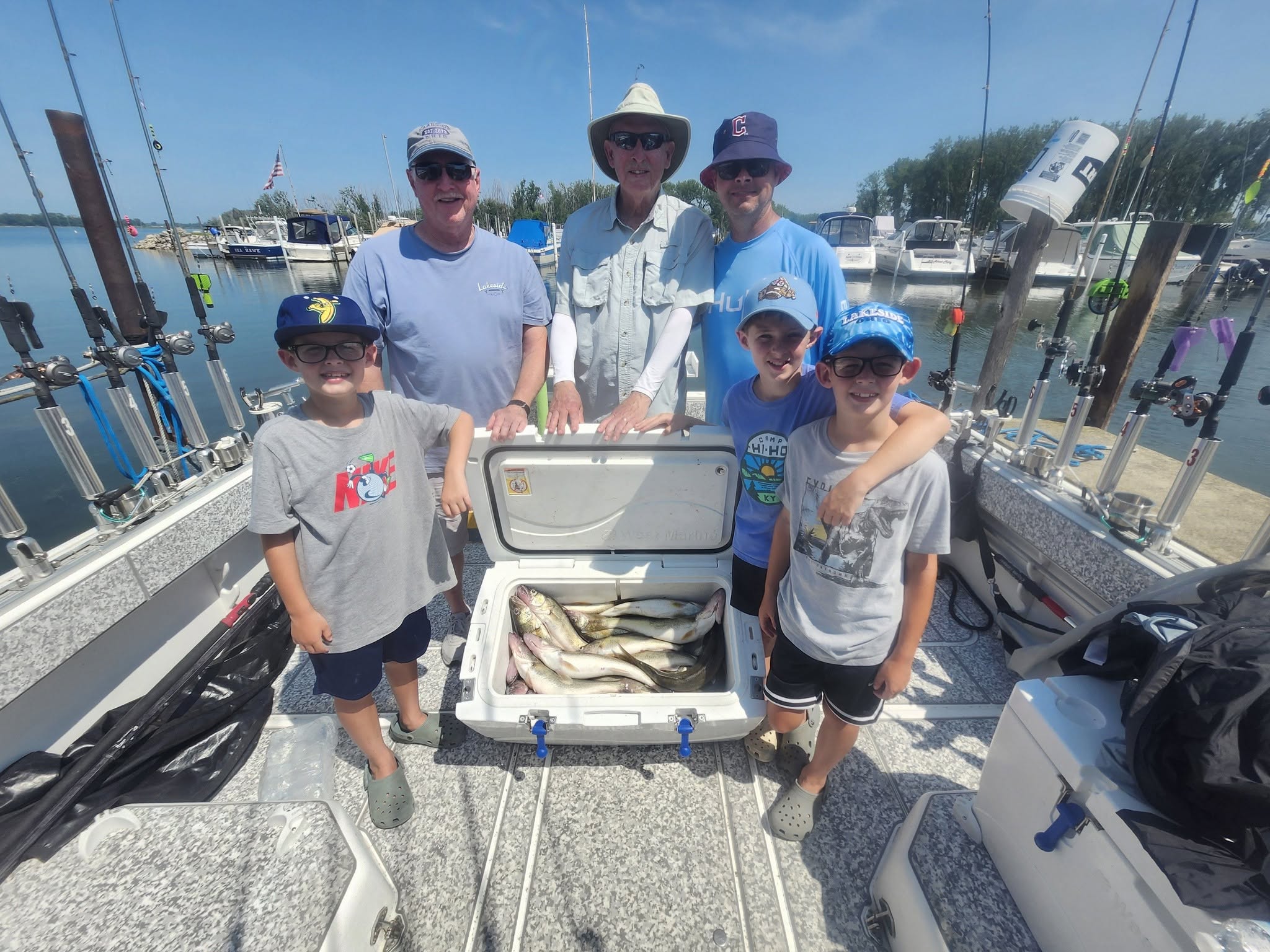 Successful fishing trip in Marblehead OH with cooler full of fresh caught fish on charter boat