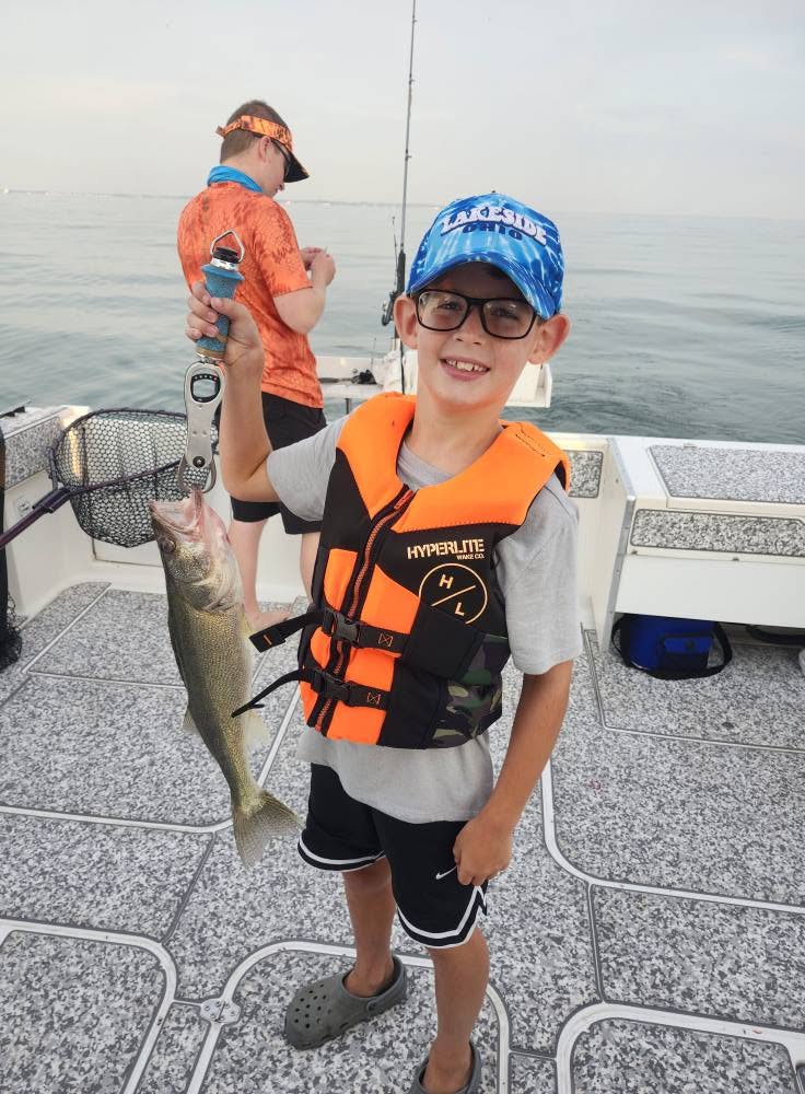 Walleye fishing success on boat in Marblehead OH with caught fish displayed