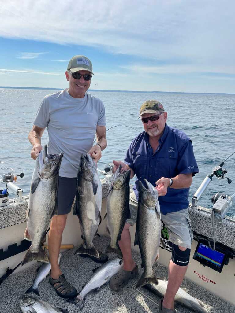 Successful chinook salmon fishing trip in Manistee MI with multiple large fish caught