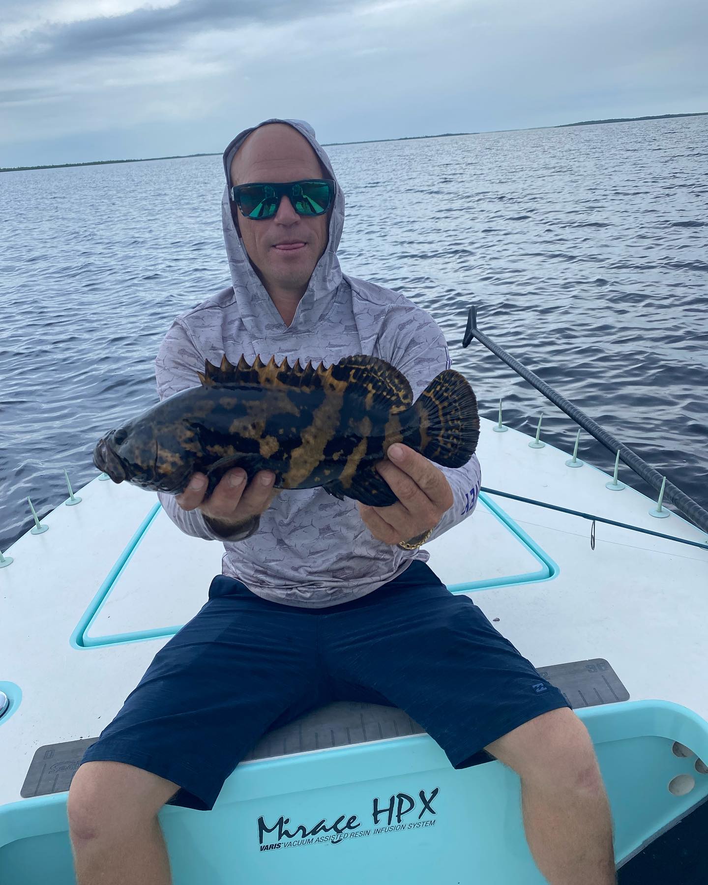 Angler holding a fishing rod with Fort Lauderdale location