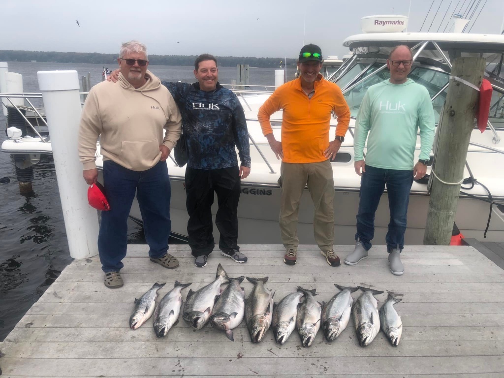 4 people fishing at Whitehall with 5 fish