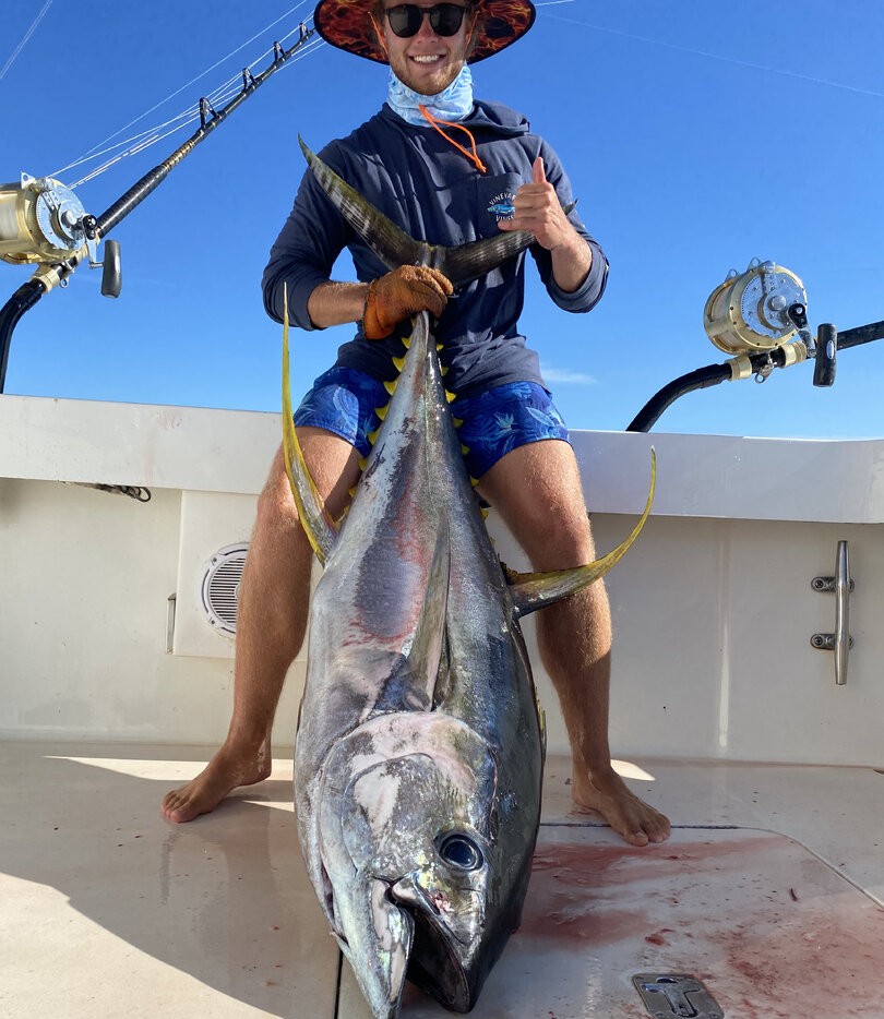 Large yellowfin tuna catch displayed on fishing boat deck in Kailua-Kona Hawaii