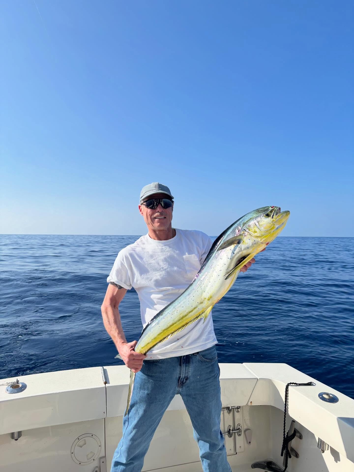 Fishing boat trolling offshore waters of Kailua-Kona for marlin, tuna and mahi mahi charter