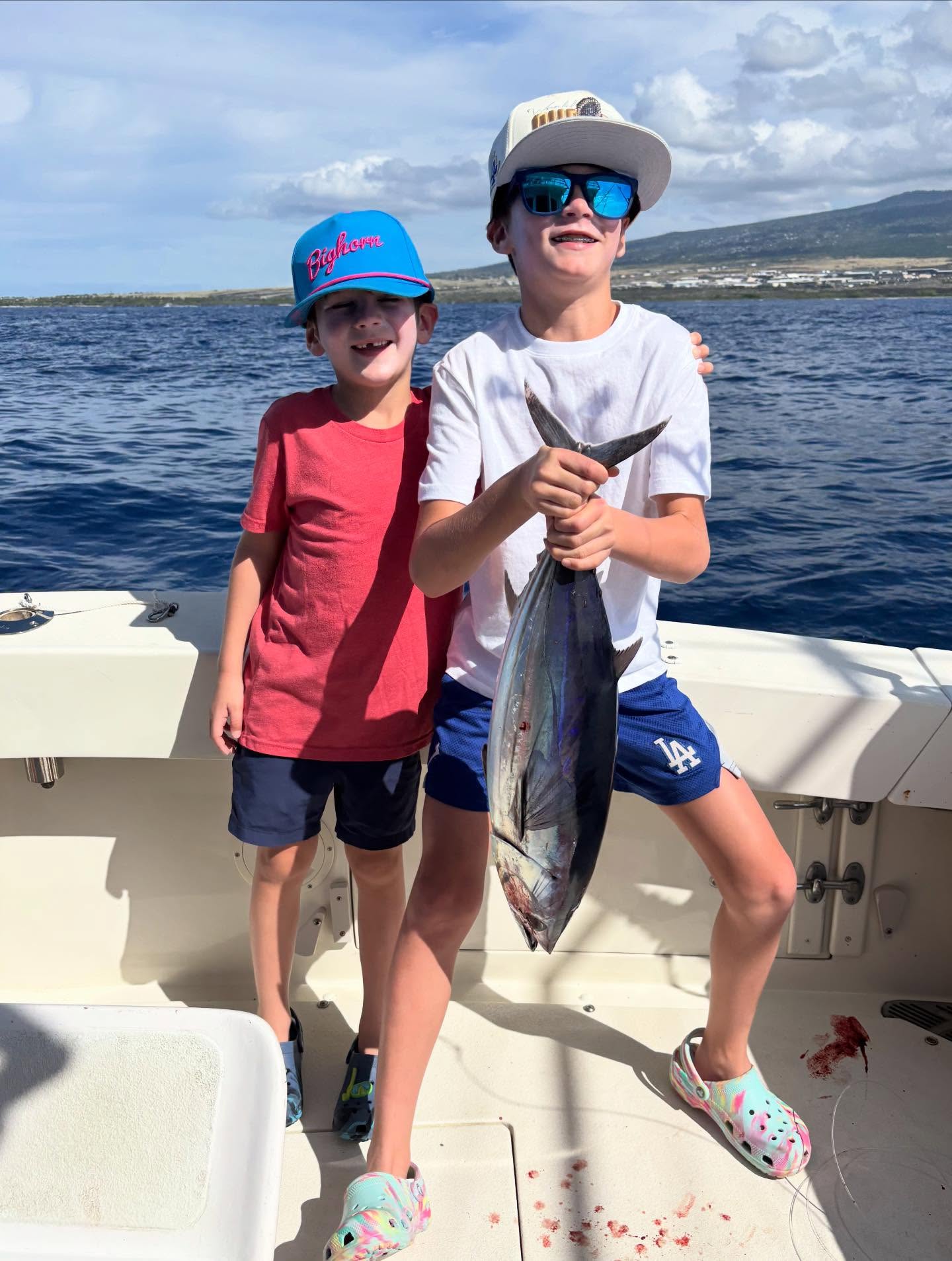 Family fishing charter boat in Kailua-Kona waters targeting marlin, tuna and mahi mahi offshore