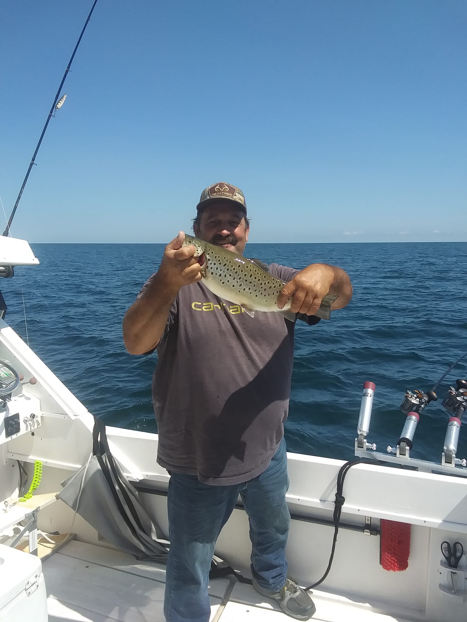 Angler with a 11-inch fish in Oswego