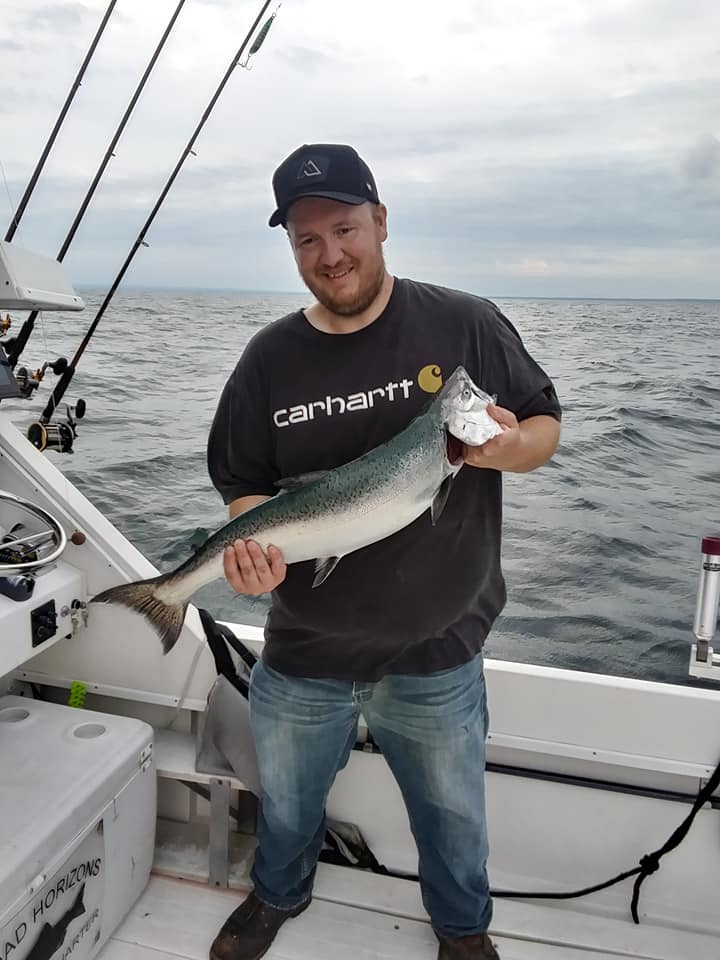 Angler with a large 21-inch fish in Oswego